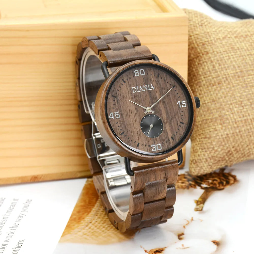 Llanera steel and black walnut watch in front of wood block