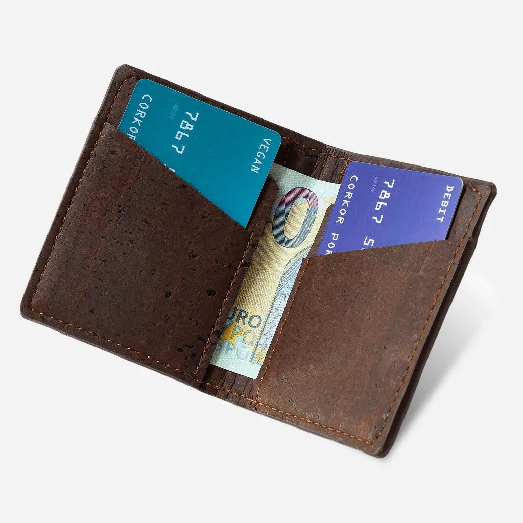 Brown slim cork wallet open with cards and a bank note