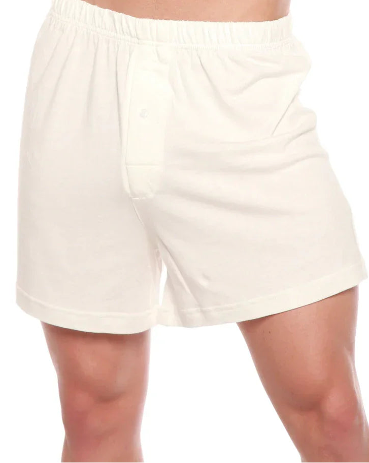 White shorts worn by a person on a white background