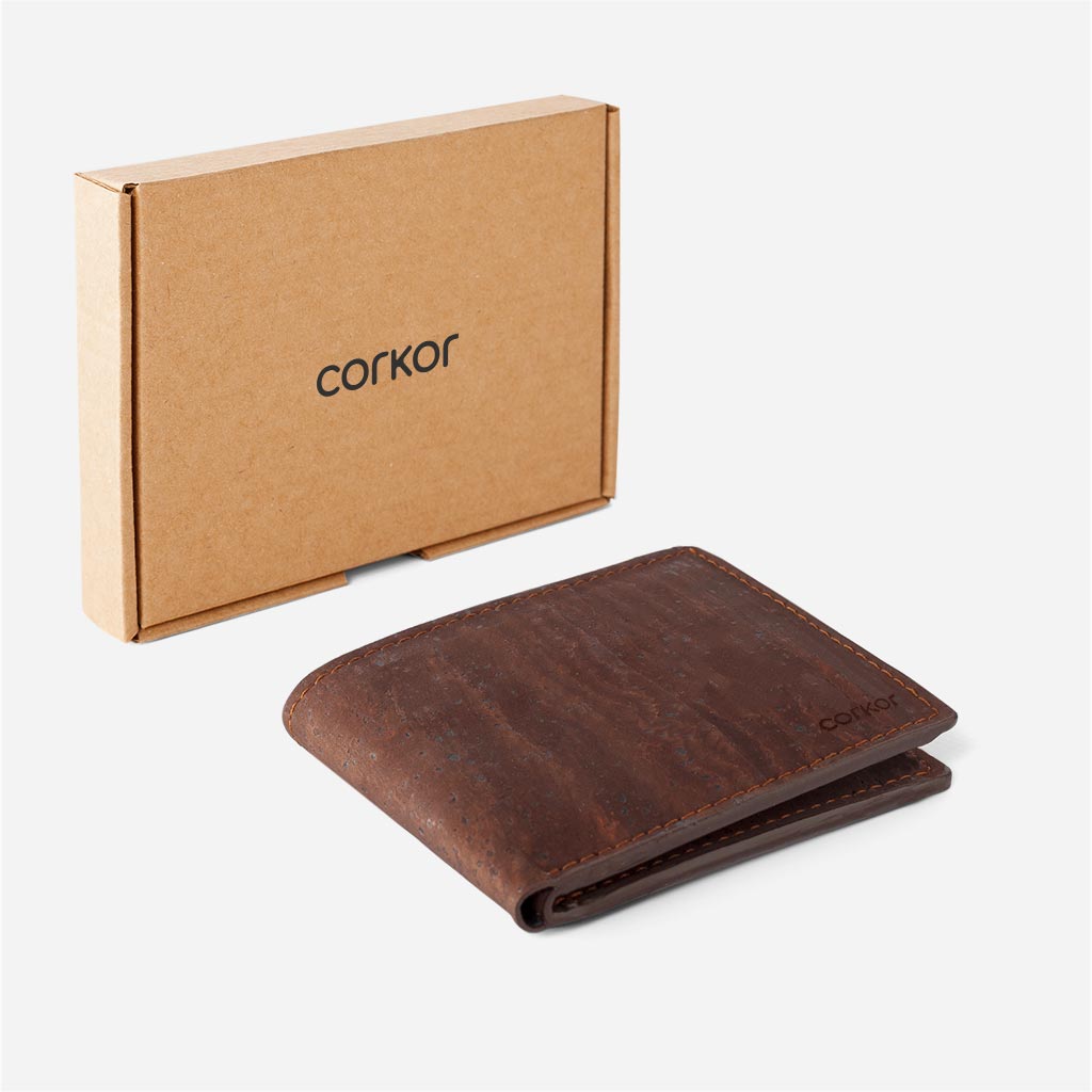 Brown slim bifold cork wallet next to its box