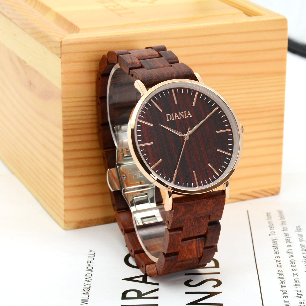 Vallada stainless steel and red sandalwood watch in front of wood block