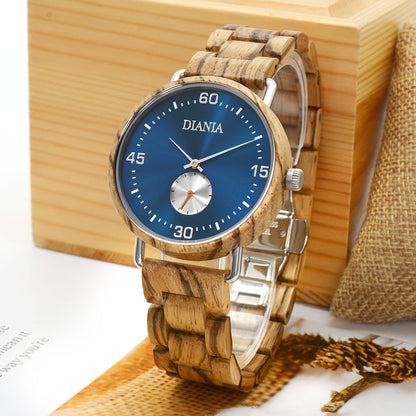 Ranes steel and zebrawood watch leaning on wood box