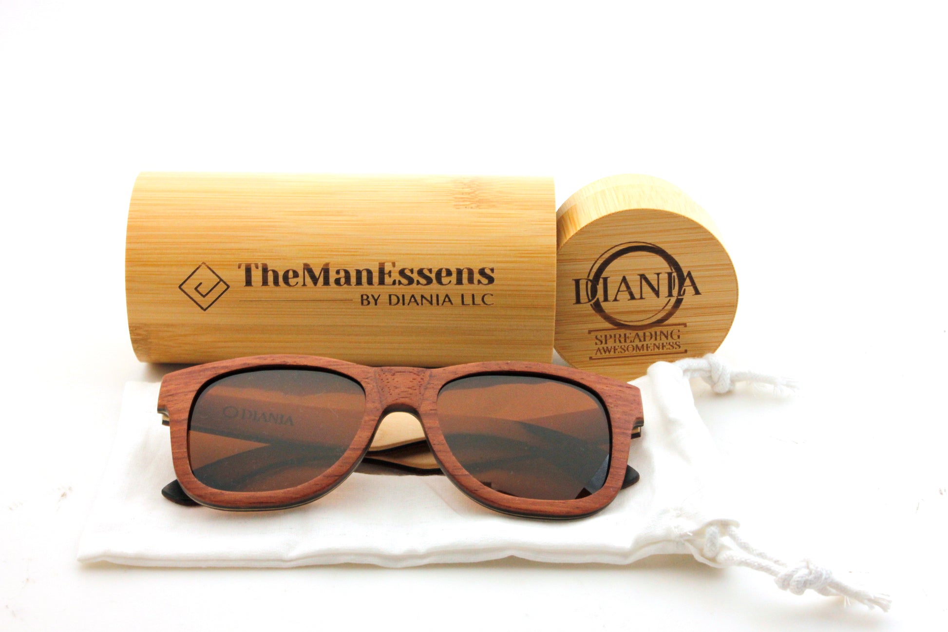 Els Plans bubinga Skateboard Wood Sunglasses on cotton bag in front of bamboo cilinder case