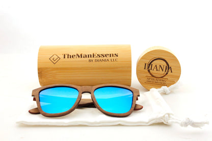 Menejador Layered Walnut Wood Sunglasses on cotton back in front of bamboo cilinder case