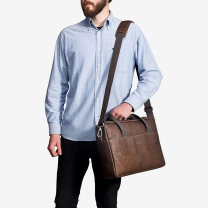 Man carrying the brown cork briefcase on its shoulder strap