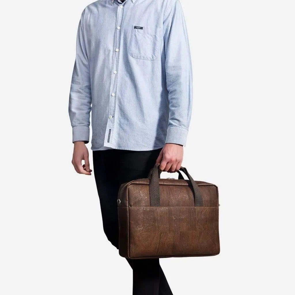 Man holding the brown cork briefcase