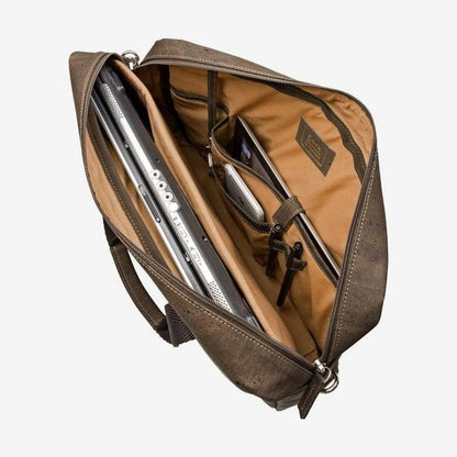 Brown cork briefcase open, showing the padded laptop pocket and inside pockets