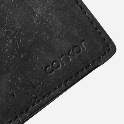 Closeup on the Corkor logo of the Cork Passcase Wallet