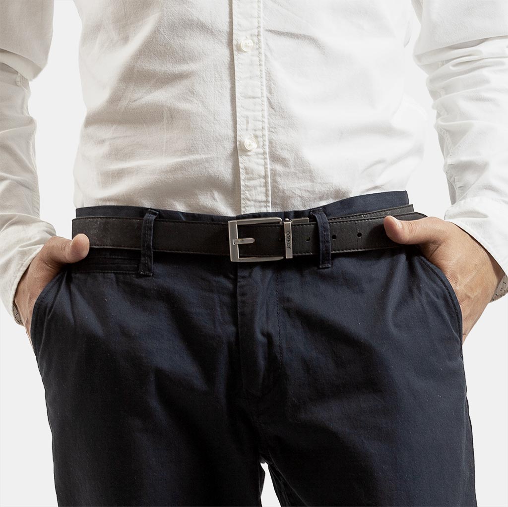 Man wearing a vegan reversible belt made from genuine cork.
